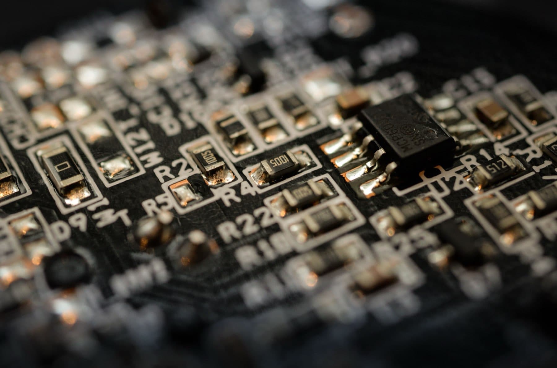 Close-up of a populated circuit board with an integrated circuit and surface-mount components