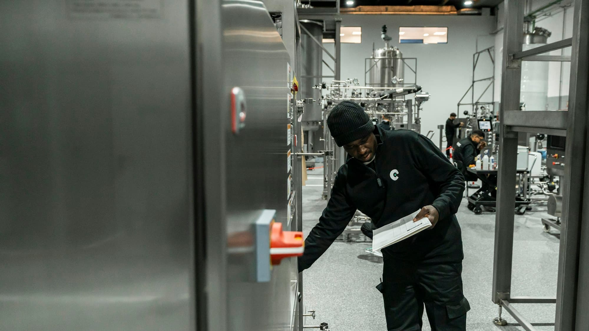 An engineer inspecting equipment in a modern factory